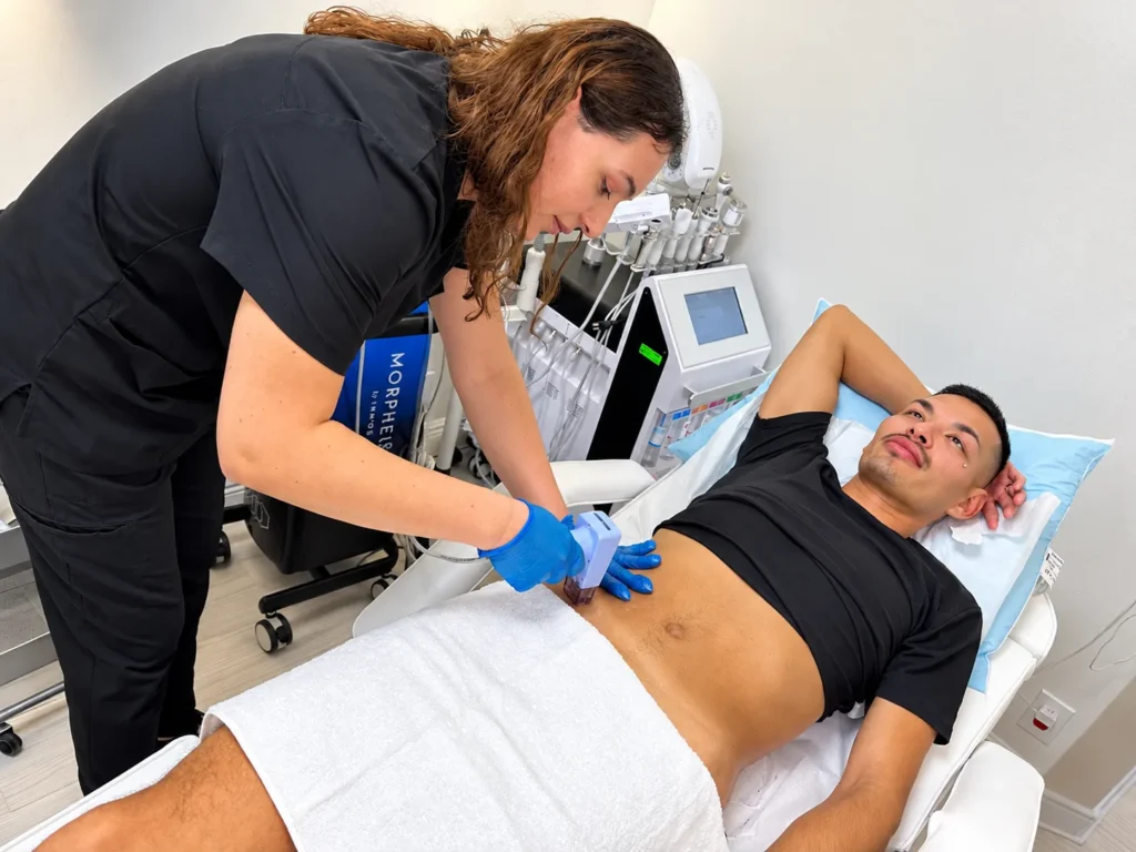 Holiday Party and Wedding-Season Glow: What a Glow Drip Can (and Can't) Add to Your Skin Plan 1 A clinician performing a skin treatment on a client at the Greenacres office, where patients ask whether a glow drip fits their skin plan